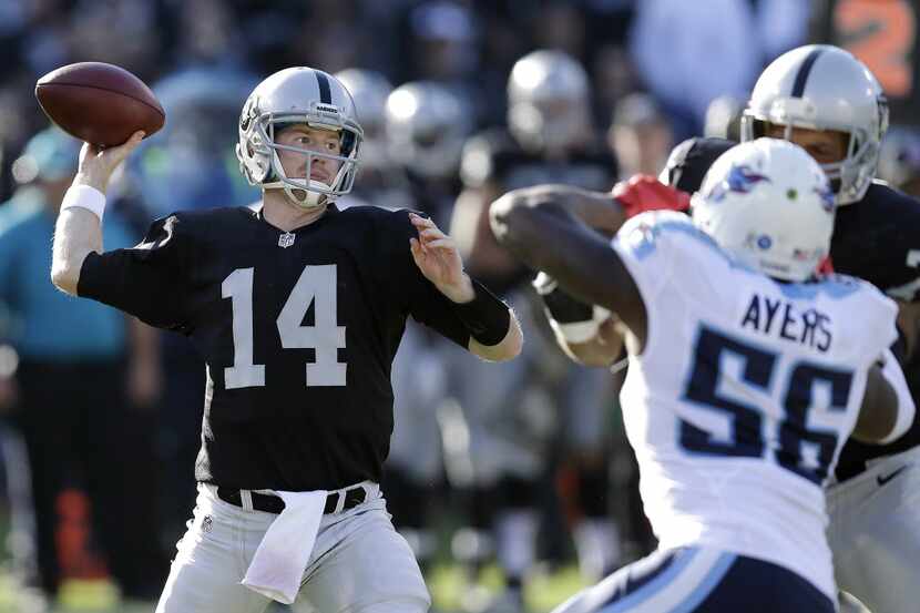 Oakland Raiders quarterback Matt McGloin (14) passes against the Tennessee Titans during the...