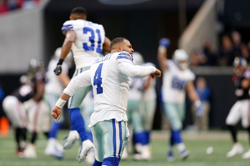 Dallas Cowboys quarterback Dak Prescott (4) celebrates after Dallas Cowboys kicker Brett...
