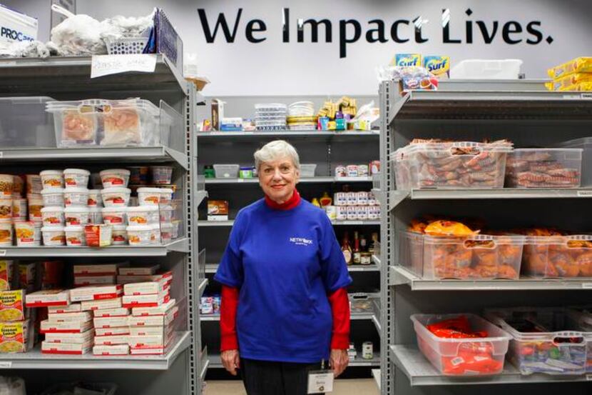 Shift coordinator Betsy Vandament of Richardson volunteers in the food bank at Network of...