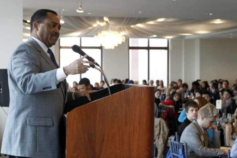 John McCaa, former anchor at WFAA-TV (Channel 8), speaks to high school students....