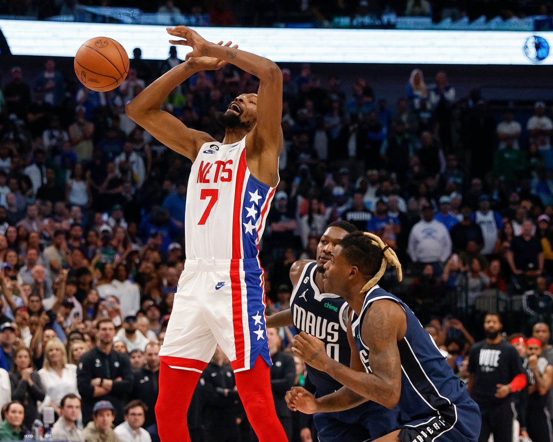 Dallas Mavericks forward Reggie Bullock (25) fouls Brooklyn Nets forward Kevin Durant (7) as...