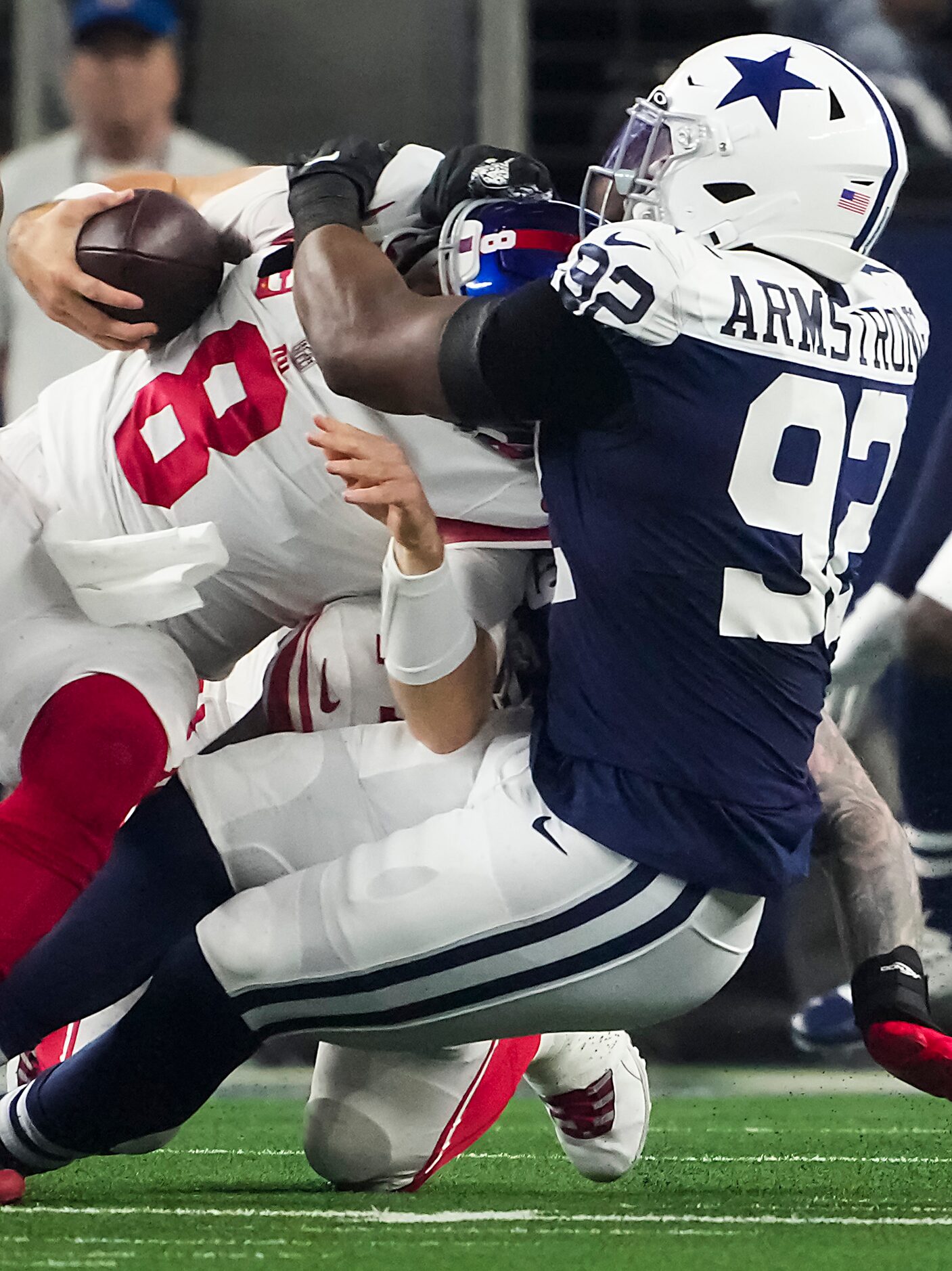 Dallas Cowboys defensive end Dorance Armstrong (92) sacks New York Giants quarterback Daniel...