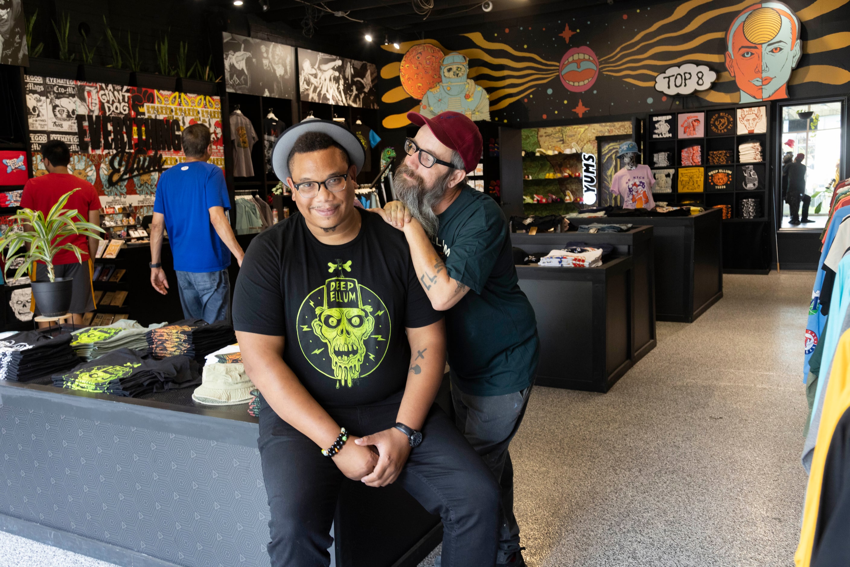 Artist Raymond Butler and Everything Ellum owner Chris Lewellyn pose for a photo at the shop...