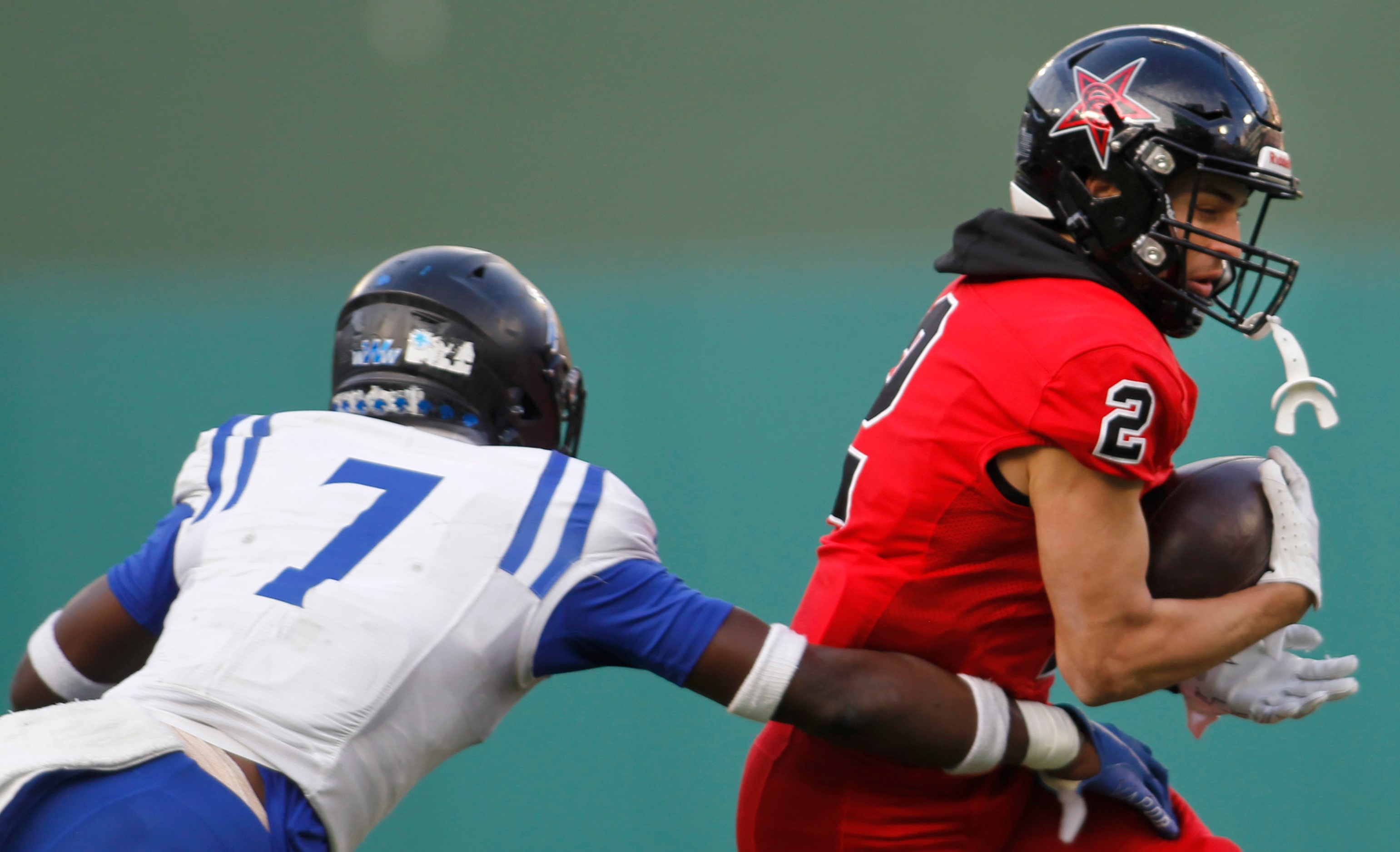 Coppell receiver Luca Grosoli (2), right, pulls in a pass in front of Byron Nelson defender...