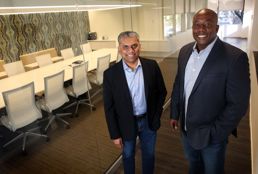 Business partners Anurag Jain (left) and Joe Beard pose for a photograph at Perot Jain, a...