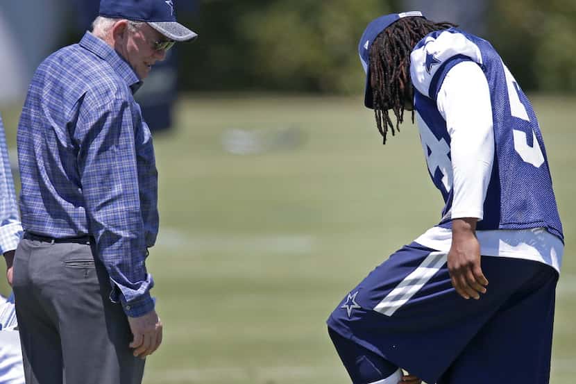 Cowboys Owner/President/General Manager Jerry Jones (left) talks with Jaylon Smith during...