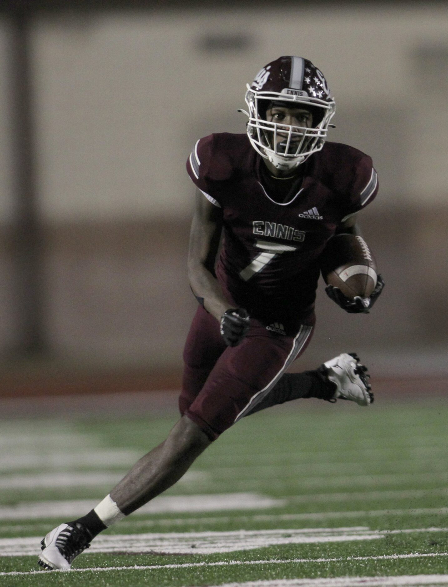 Ennis receiver Laylon Spencer (7) tacks on extra yardage after a second quarter reception...