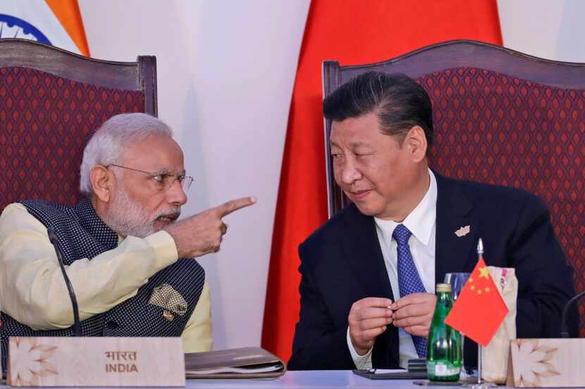 Indian Prime Minister Narendra Modi (left) talks with Chinese President Xi Jinping at the...
