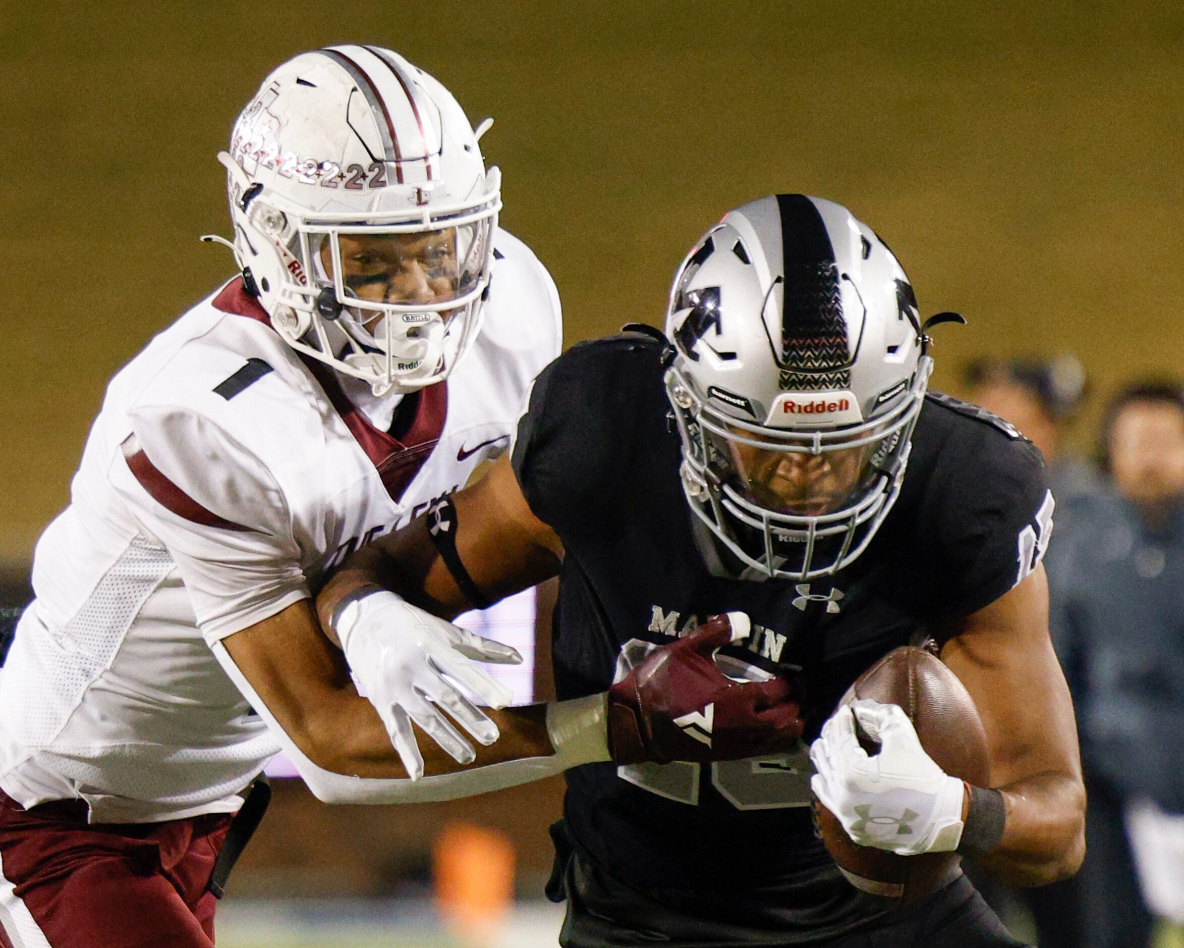 Lewisville defensive back Jaydan Hardy (1) tackles Arlington Martin wide receiver Ismael...