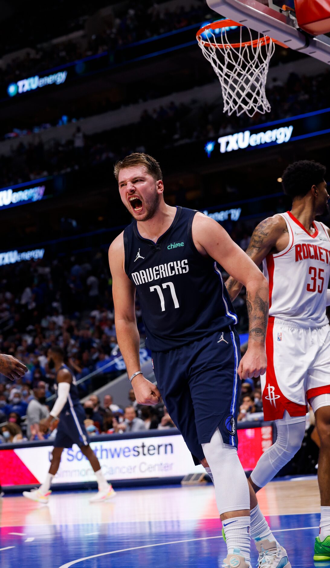 Dallas Mavericks guard Luka Dončić (77) reacts after making a basket during the fourth...