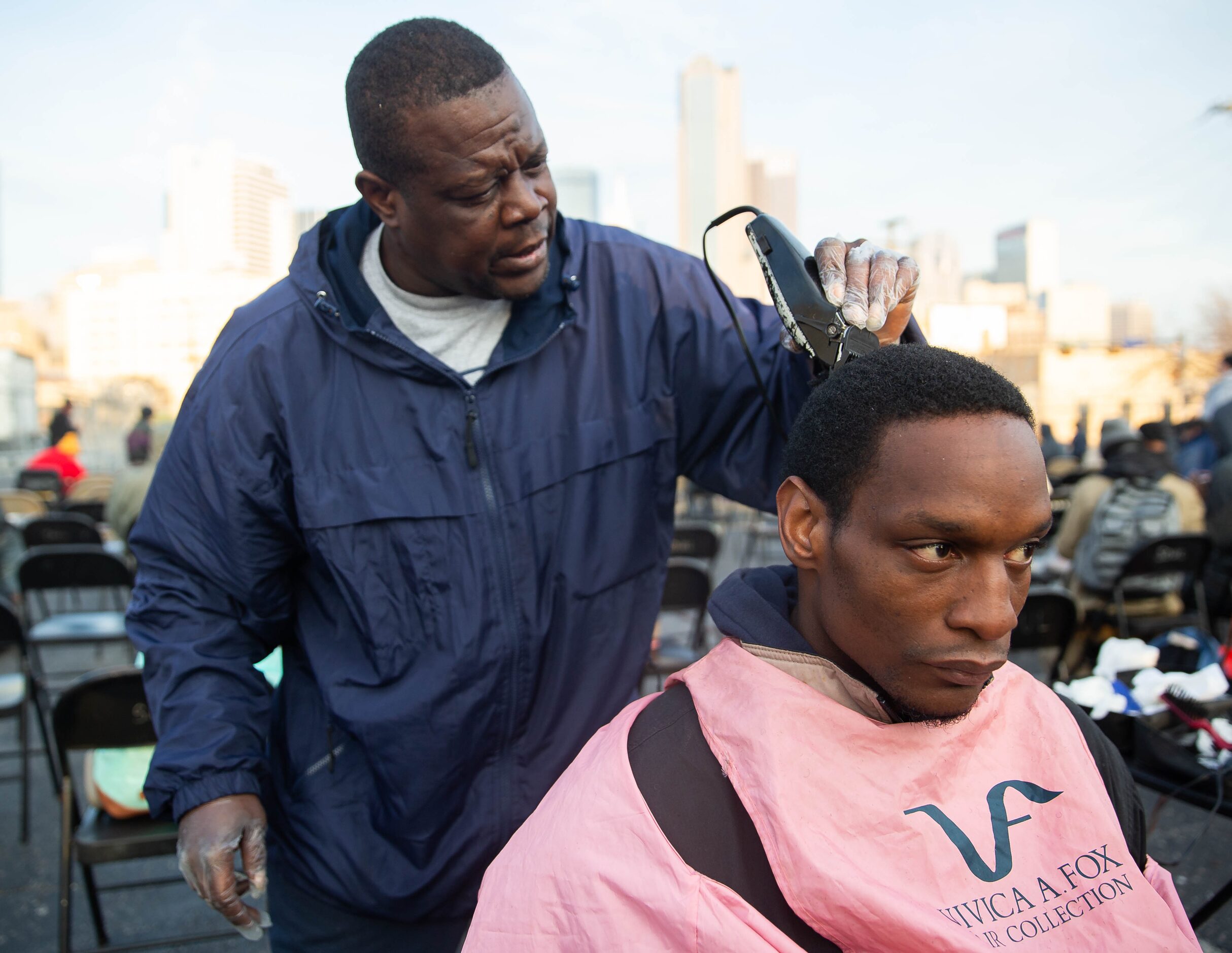 Isaac Bell (left) cut John Crawford's hair at S.O.U.L. Church on Dec. 8, 2019. Bell said he...