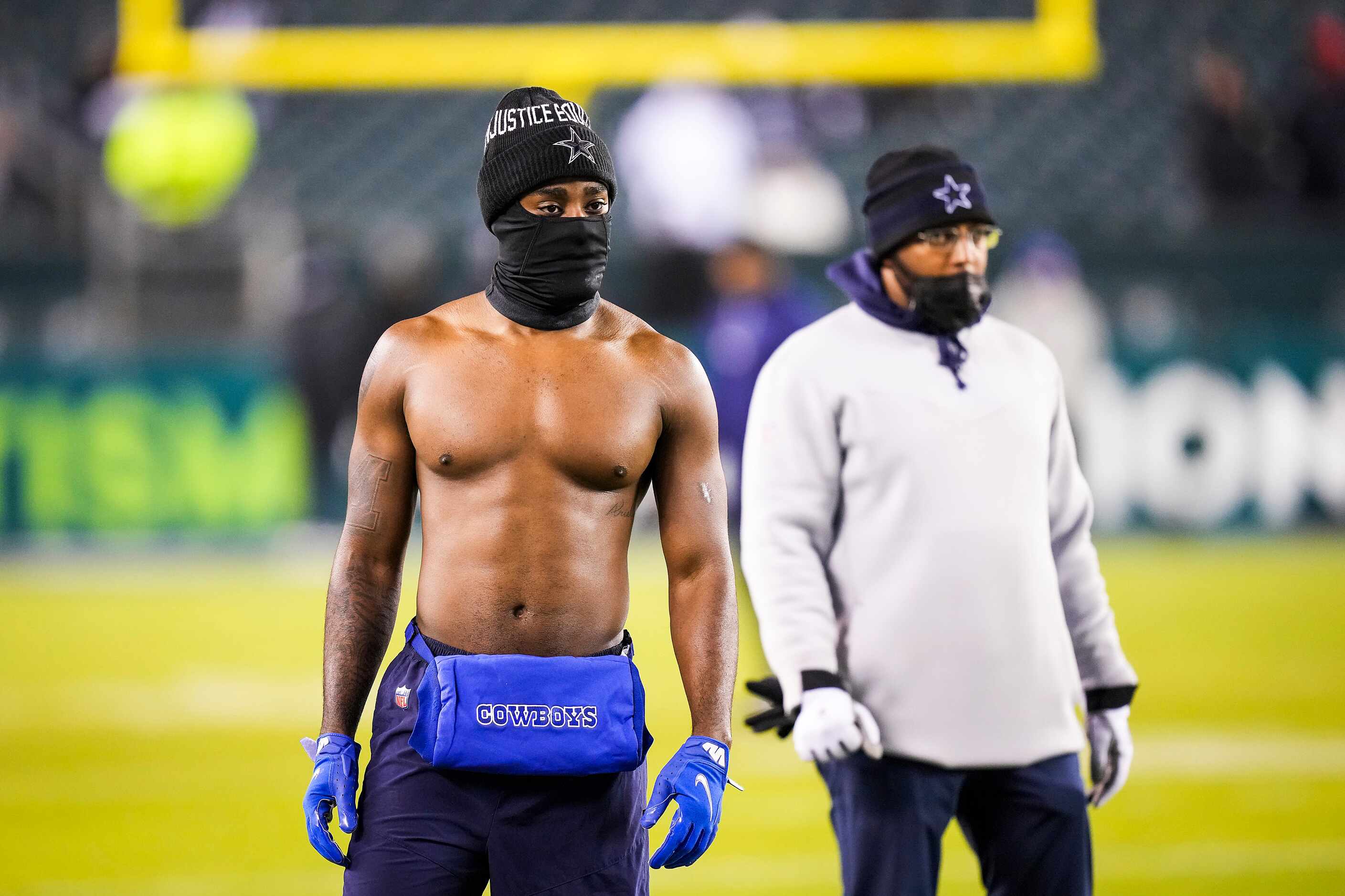 Dallas Cowboys cornerback Jourdan Lewis goes shirtless despite the cold temperatures as he...