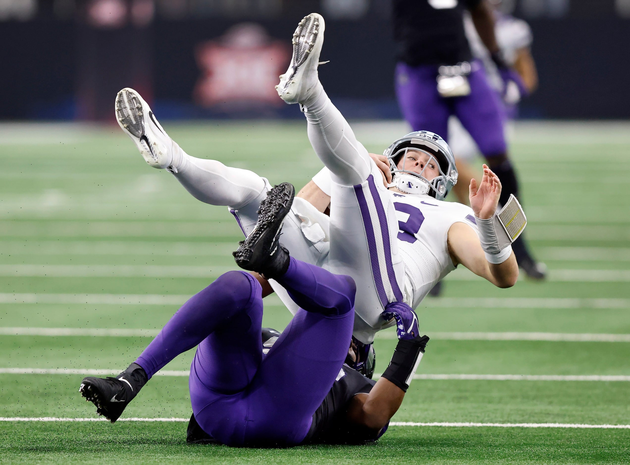 Kansas State Wildcats quarterback Will Howard (18) is sacked by TCU Horned Frogs defensive...