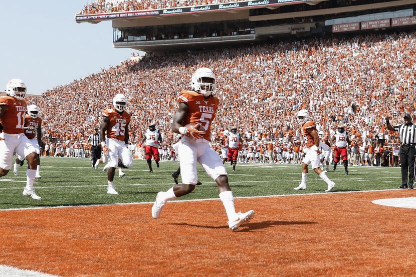 AUSTIN, TX - SEPTEMBER 02:  Holton Hill #5 of the Texas Longhorns intercepts a pass and...