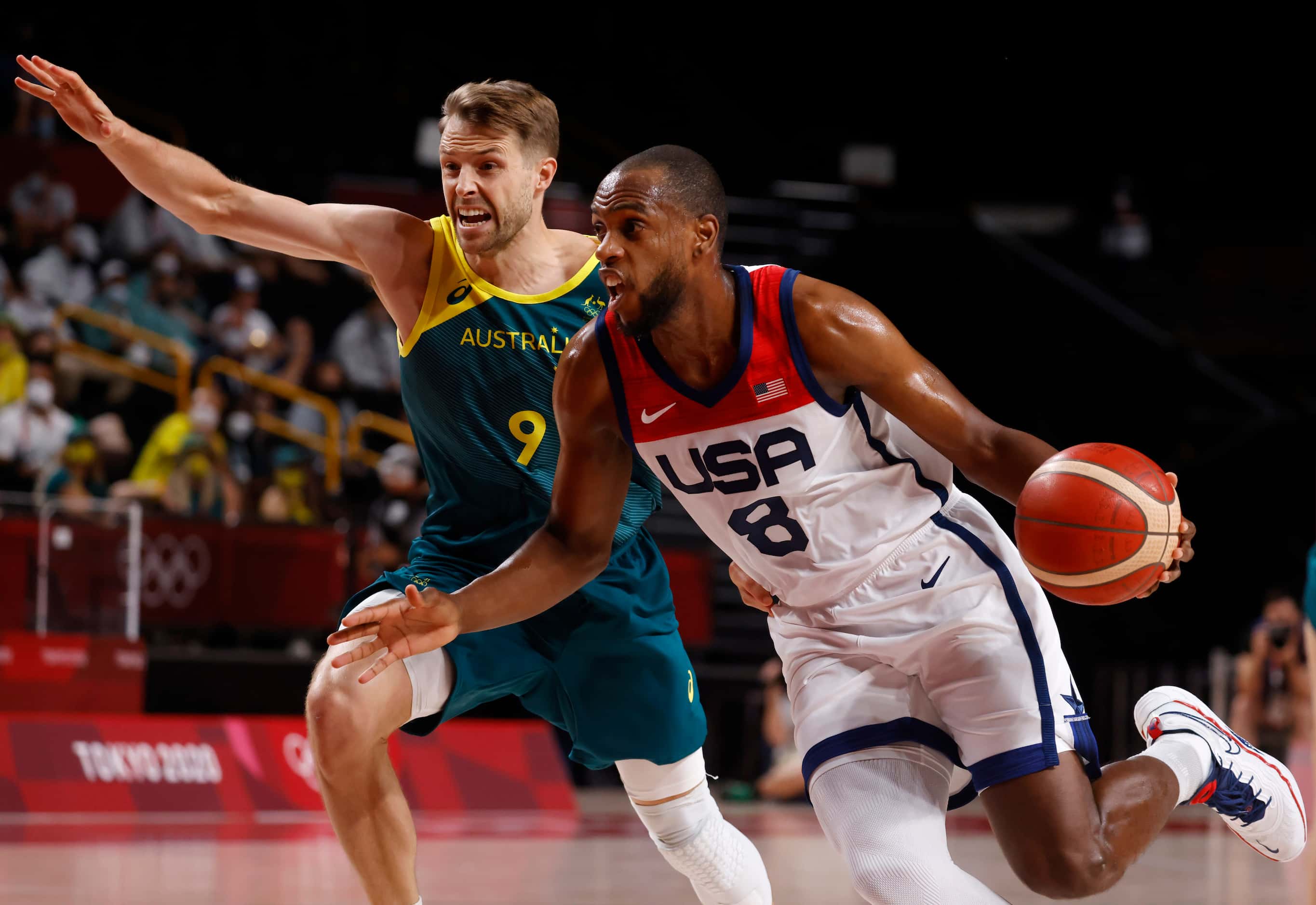 USA’s Khris Middleton (8) drives on Australia’s Nathan Tobey (9) during the first half of a...