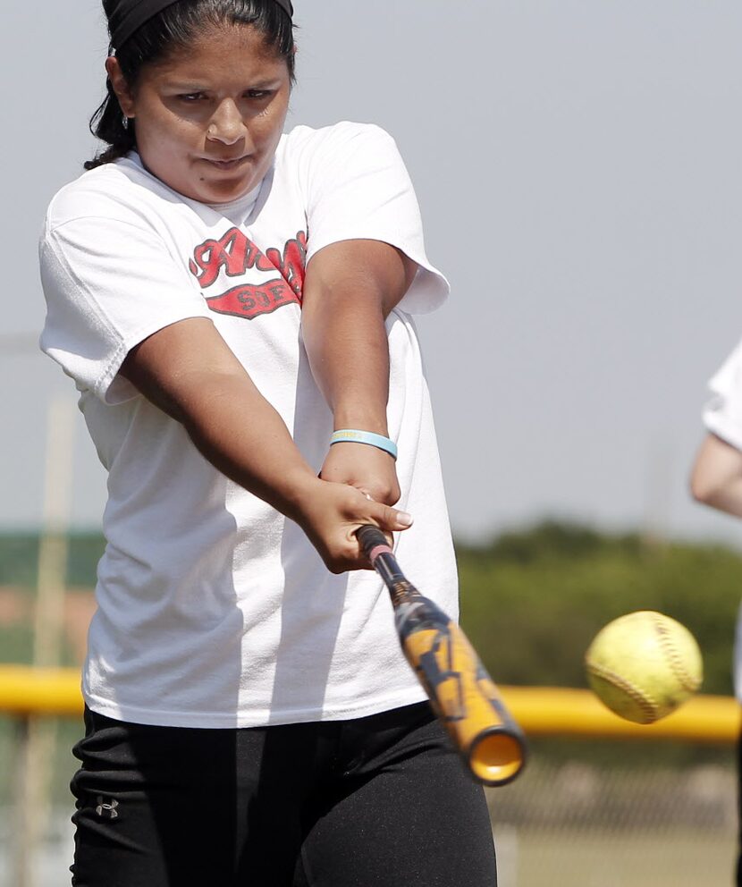 Argyle varsity shortstop Adilen Gonzalez participates in softball drills during practice at...