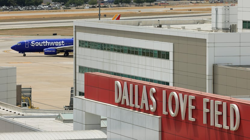 A Southwest Airlines plane taxis toward the runway at Dallas Love Field Airport.