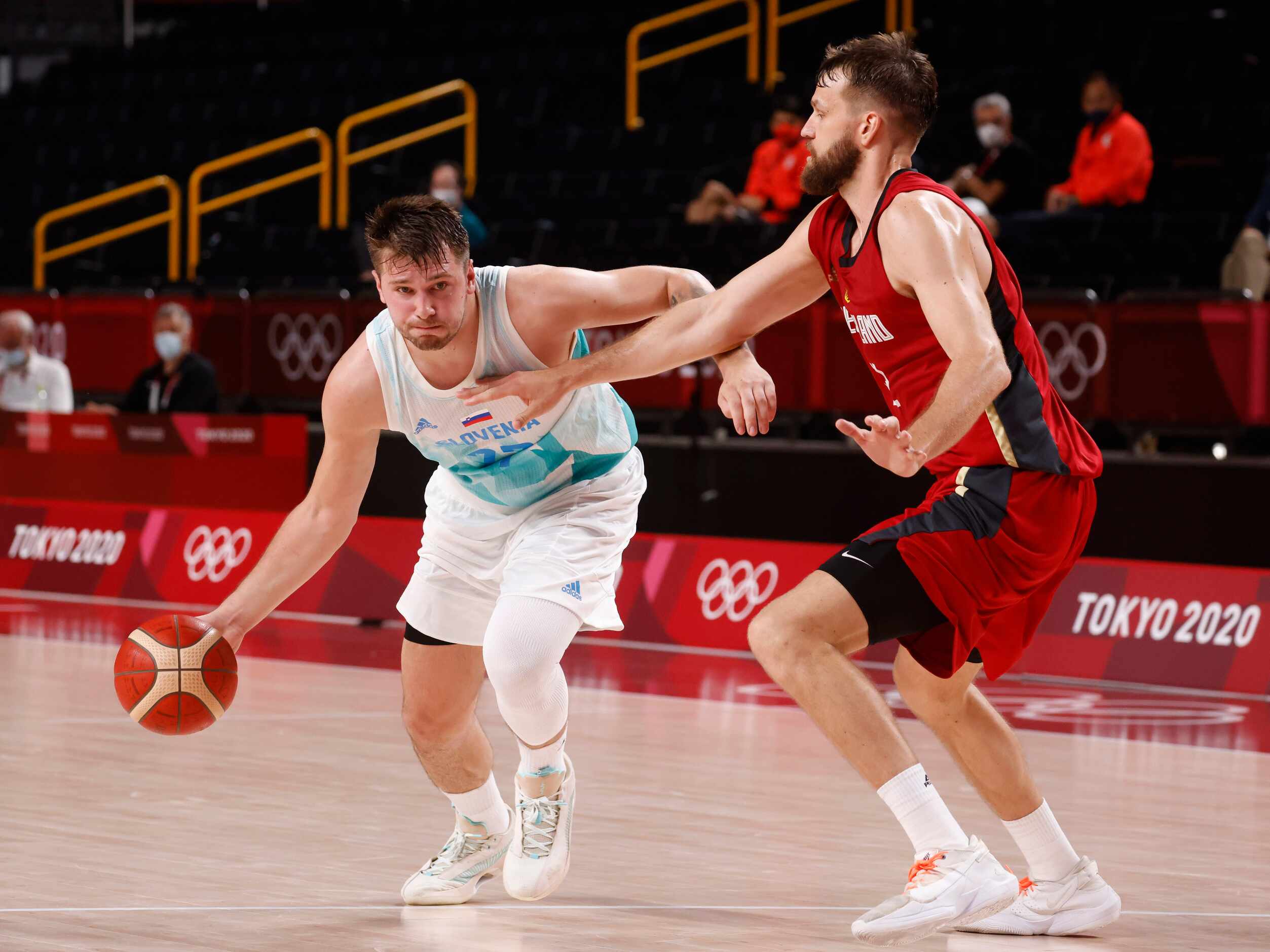 Slovenia’s Luka Doncic (77) drives on Germany’s Danilo Barthel (22) during the second half...