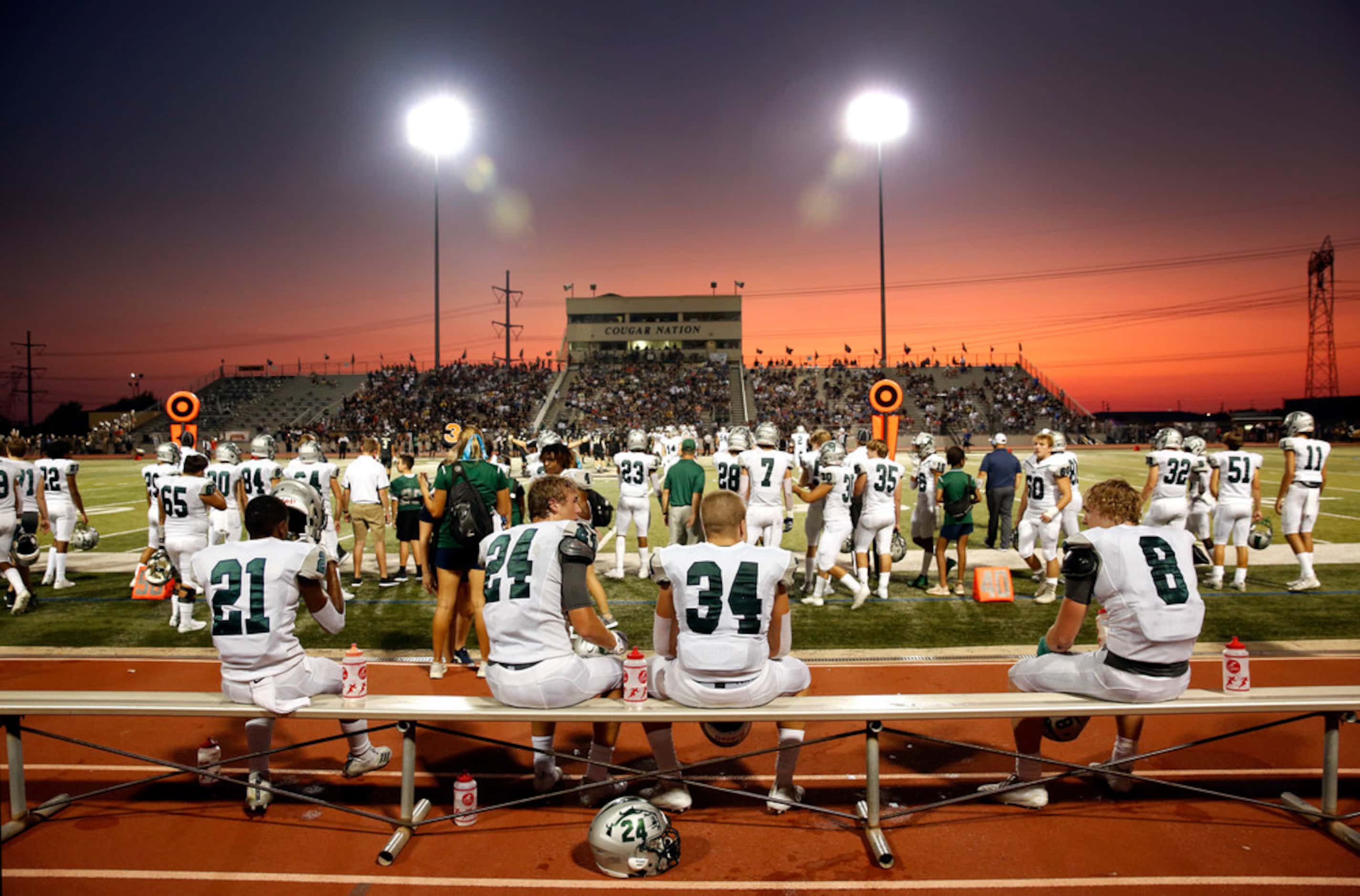 As the sun sets at Tommy Briggs Cougar Stadium in The Colony, Texas, Frisco Reedy defensive...