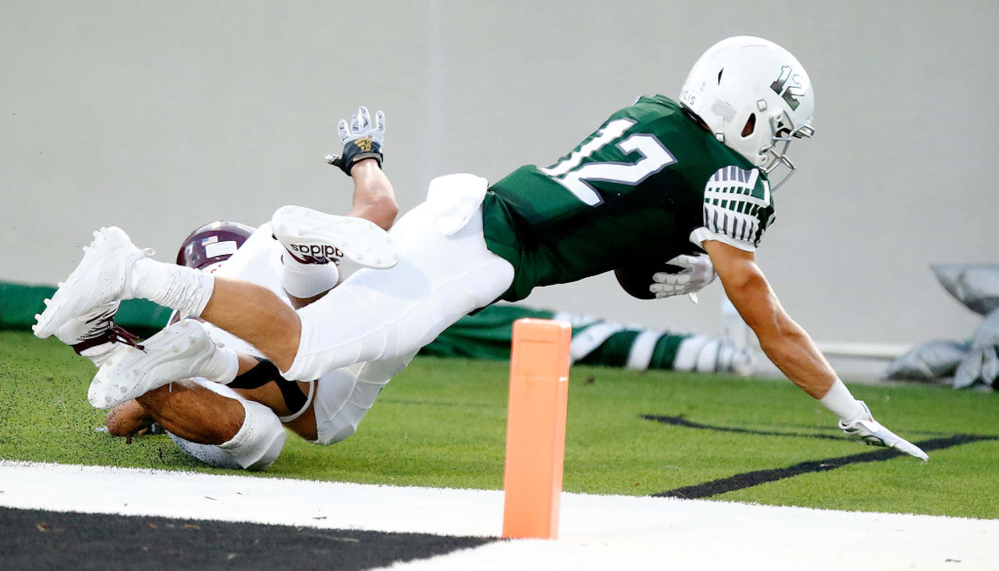 Prosper High School wide receiver Hayden Metcalf (12) catches a trouchdown pass during the...