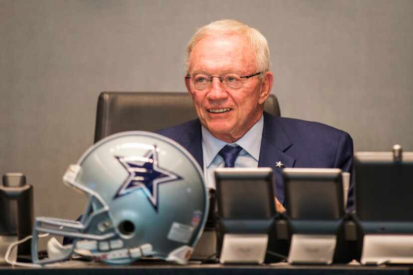 FILE - Cowboys owner Jerry Jones looks at the video board in the war room during Round 1 of...