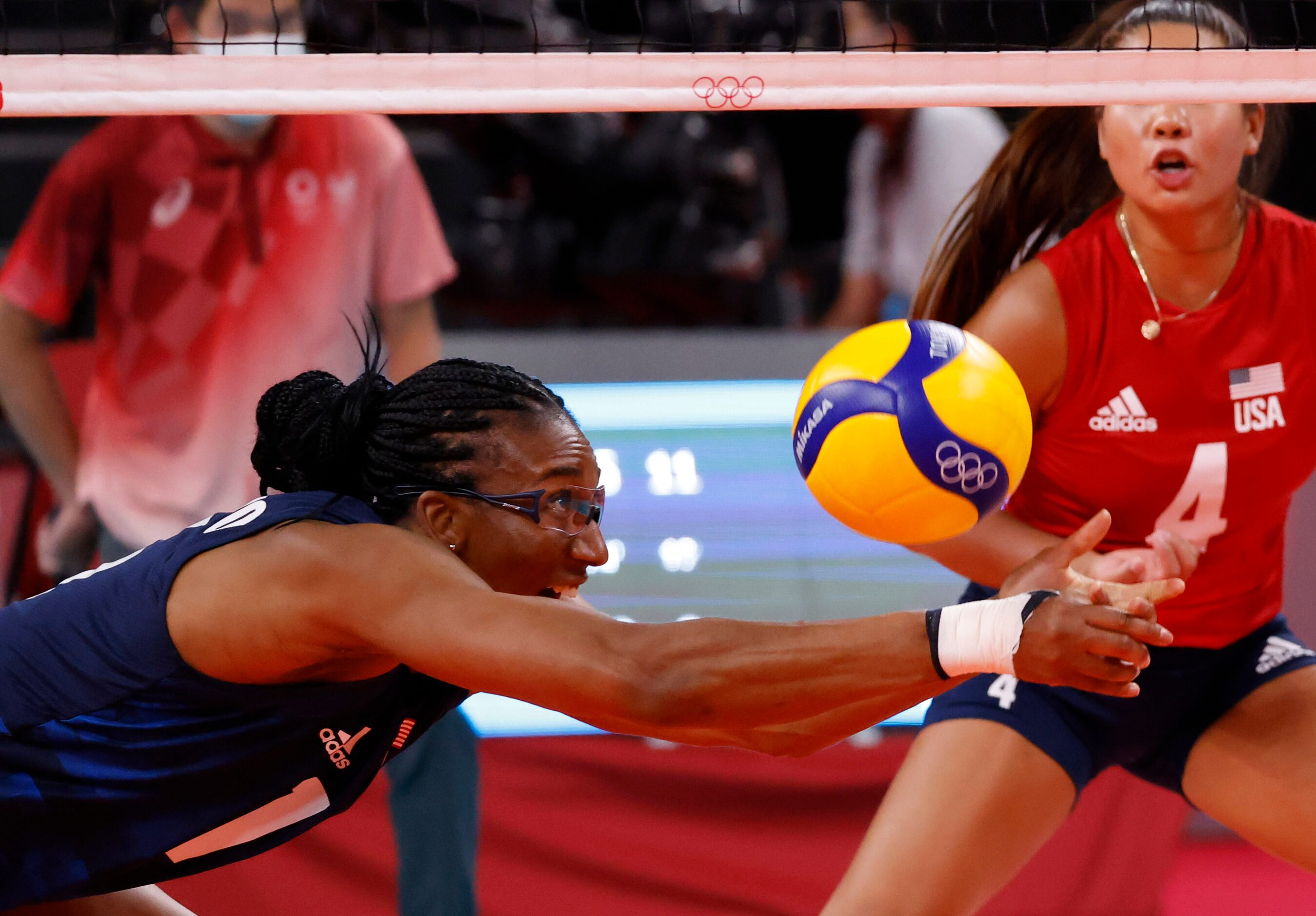 USA’s Foluke Akinradewo (16) dives for the ball in a volleyball game against Argentina...