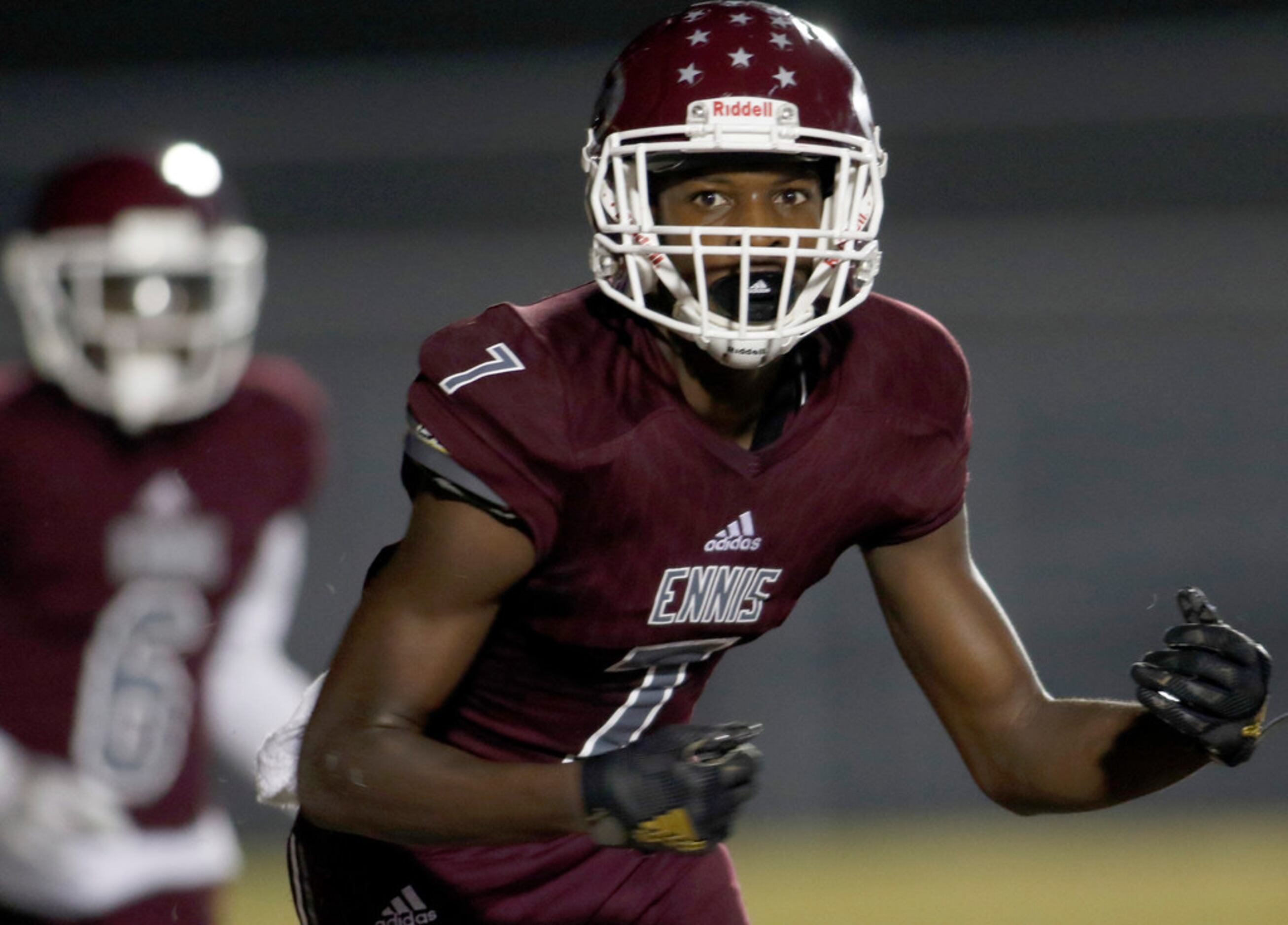 Ennis receiver Laylon Spencer (7) anxiously awaits the signal from a referee following a...