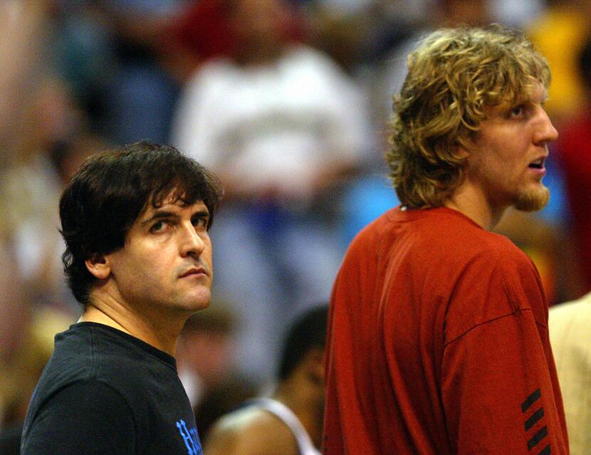 The Dallas Mavericks owner Mark Cubain (left) and the Mavericks Dirk Nowitzki (right) watch...