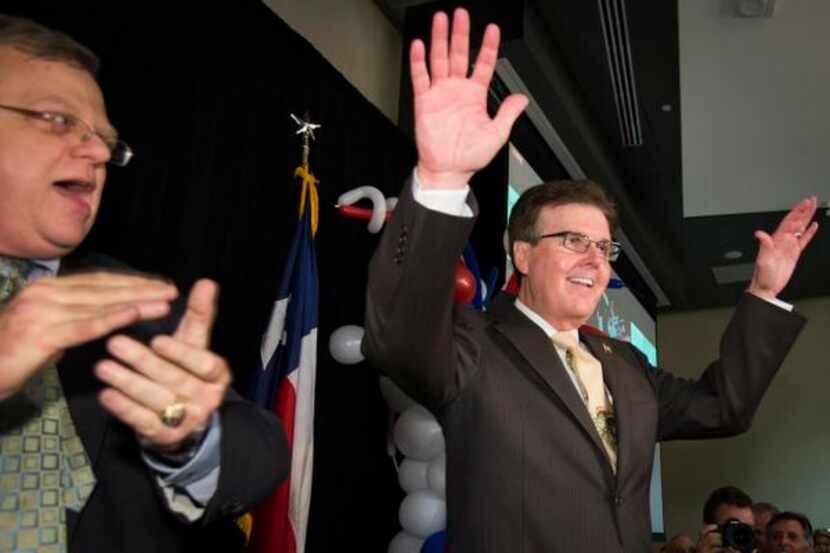 
State Sen. Dan Patrick waves to supporters during a election-night watch party after the...