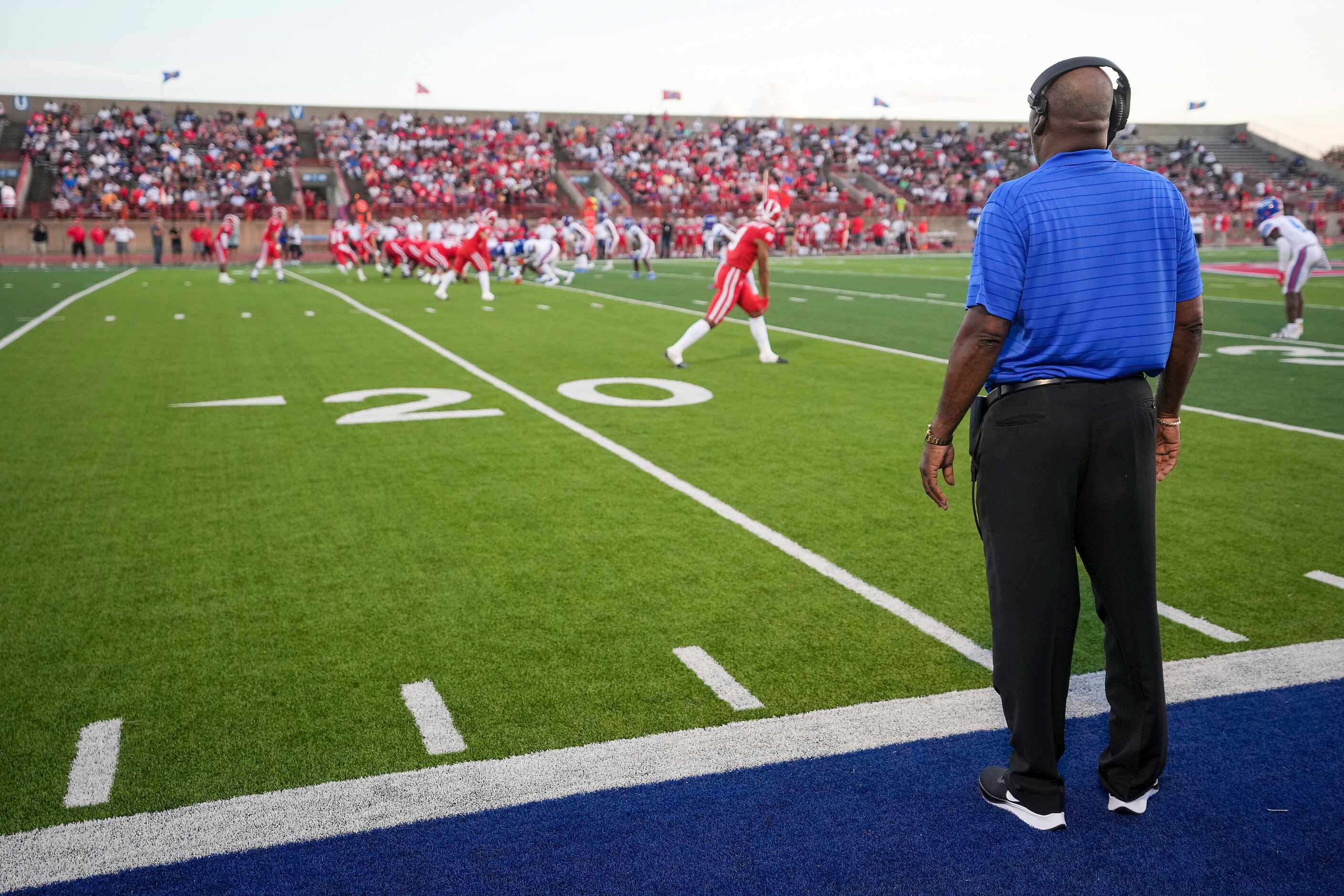 Duncanville head coach Reginald Samples watches his team line up for a play against Mater...