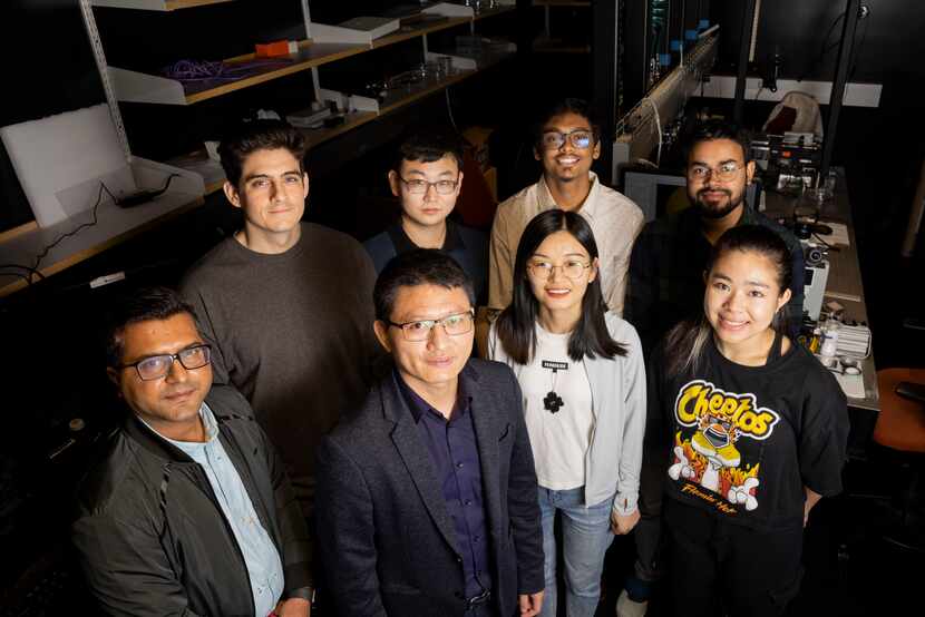 Xianming "Simon" Dai (front center left) poses with his lab on Nov. 10 at UT Dallas’ Natural...