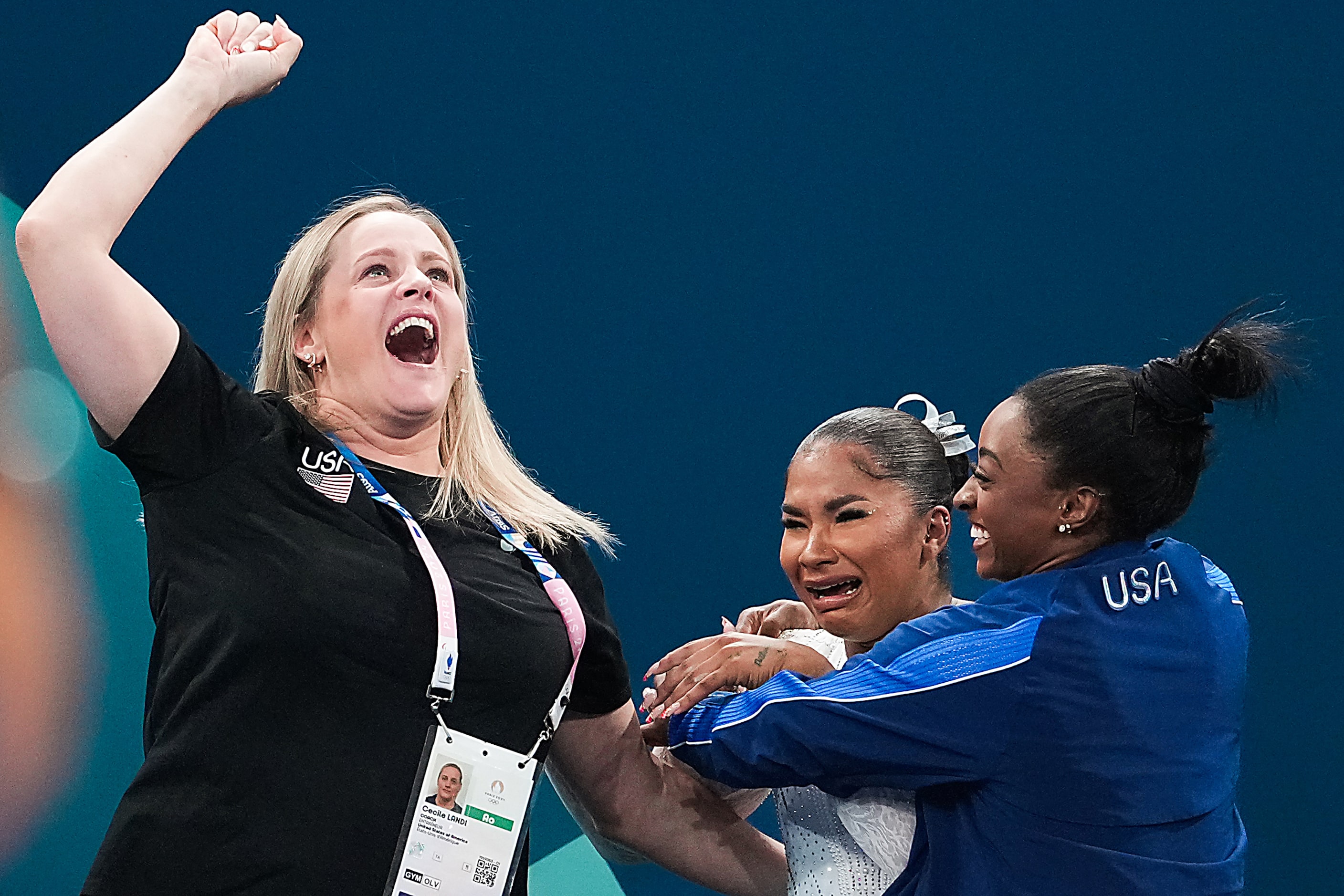 Coach Cecile Landi (left) celebrates with Jordan Chiles (center) and Simone Biles of the...