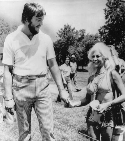 Former TCU basketball player Stan Farr and Priscilla Davis hold hands at the Colonial...
