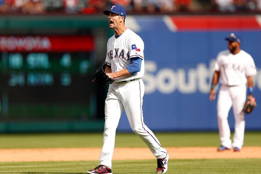 Texas Rangers starting pitcher Cole Hamels (35) reacts after giving up a single to Houston...
