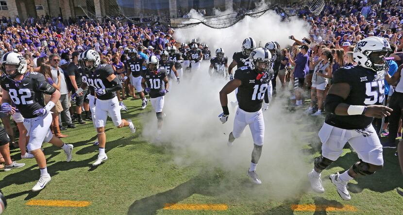 The TCU Horned Frogs take the field before the West Virginia Mountaineers vs. the TCU Horned...