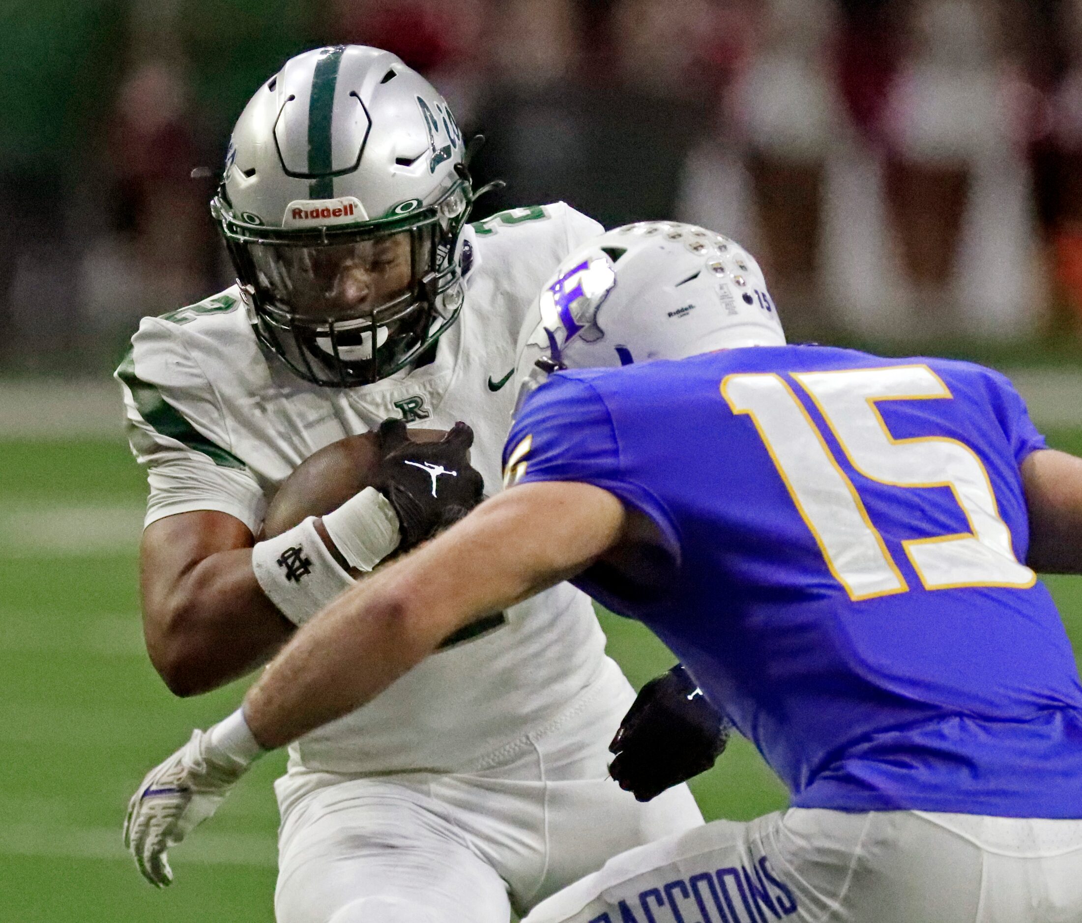 Reedy High School running back Kahlil Smith (2) prepares to take a hit from Frisco High...