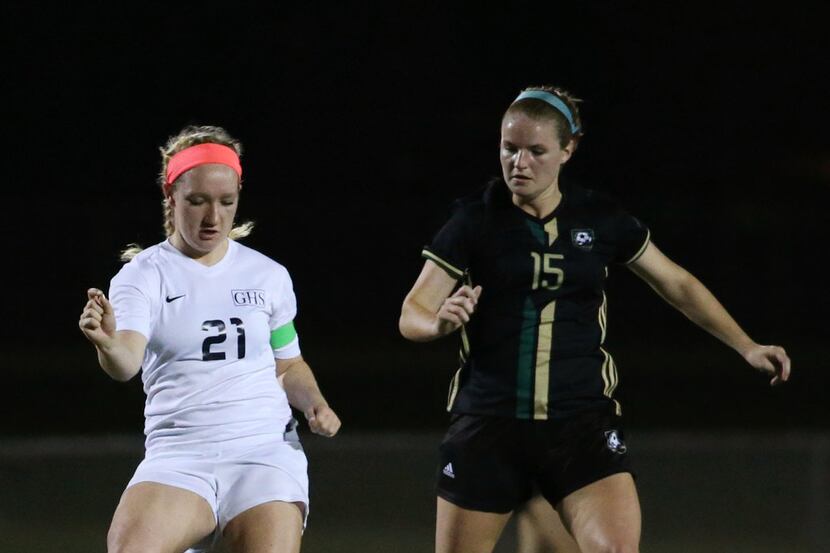 Grapevine's Sophie Smith (21) moves the ball against Birdville's Jaclyn Beeter (15) during...