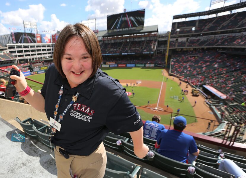 Texas Rangers usher Hannah Speirs shows her dance moves as she is pictured in Section 224...