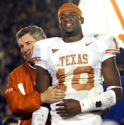  1/1/05 - Pasadena, California - Texas head coach Mack Brown hugs Rose Bowl MVP quarterback...