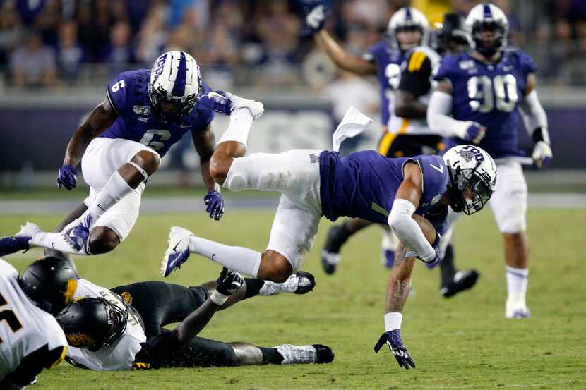 FILE - TCU safety Trevon Moehrig (7) dives for yards after returning an interception in the...
