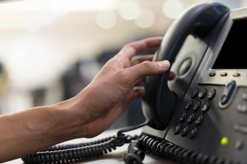 Workers operating a new statewide Texas Health and Human Services hotline dedicated to...