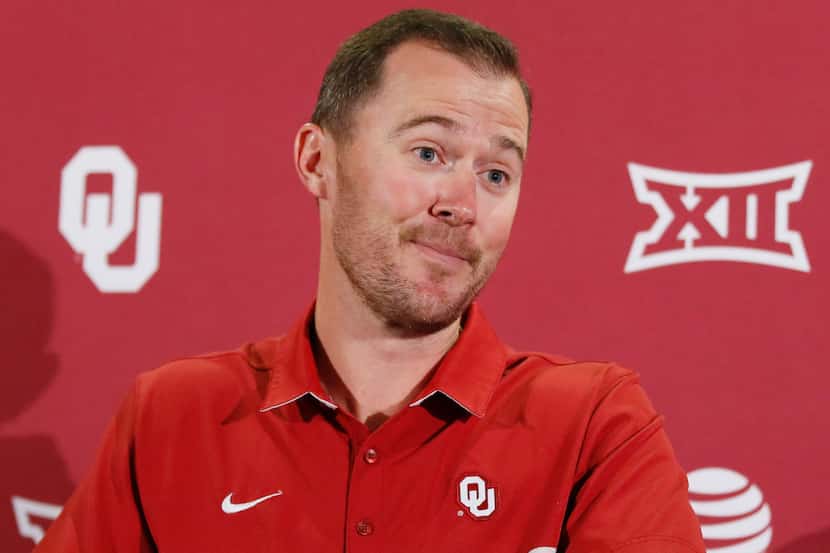 Oklahoma head coach Lincoln Riley listens to a question during an NCAA college football news...