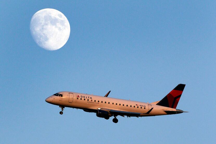 FILE- In this Tuesday, Aug. 28, 2012, file photo, a Delta connection airplane approaches...