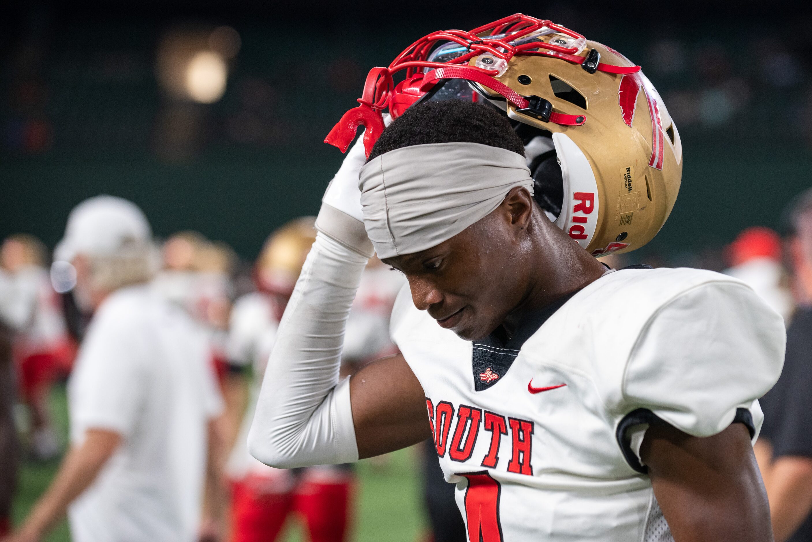 South Grand Prairie senior wide receiver D'Arius Carmouche (4) holds his head down as he...