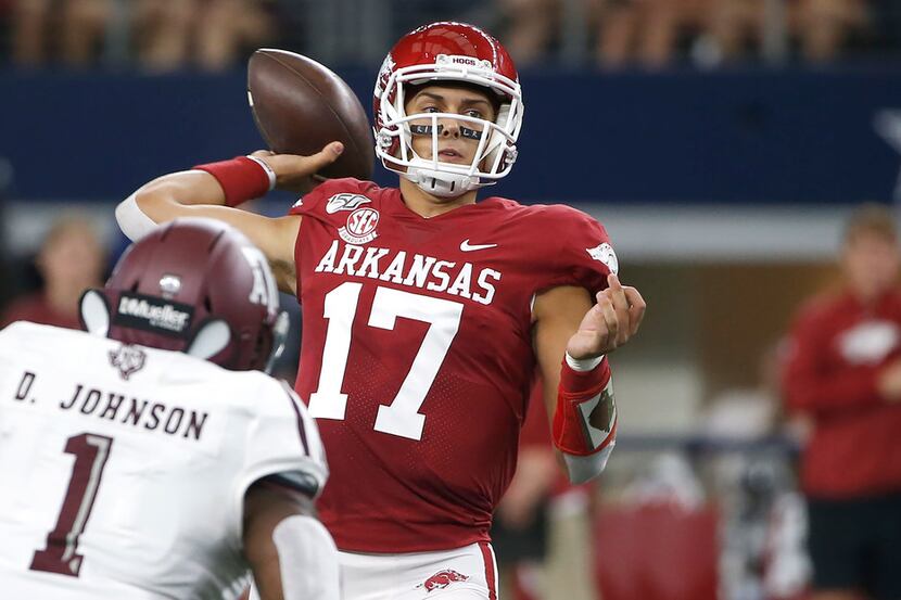 Arkansas quarterback Nick Starkel (17) throws as Texas A&M linebacker Buddy Johnson (1)...