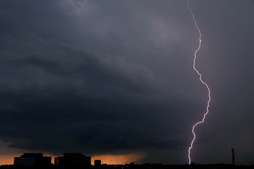 A lightning bolt from a thunderstorm strikes down in Irving, Texas, Thursday, June 7, 2018....