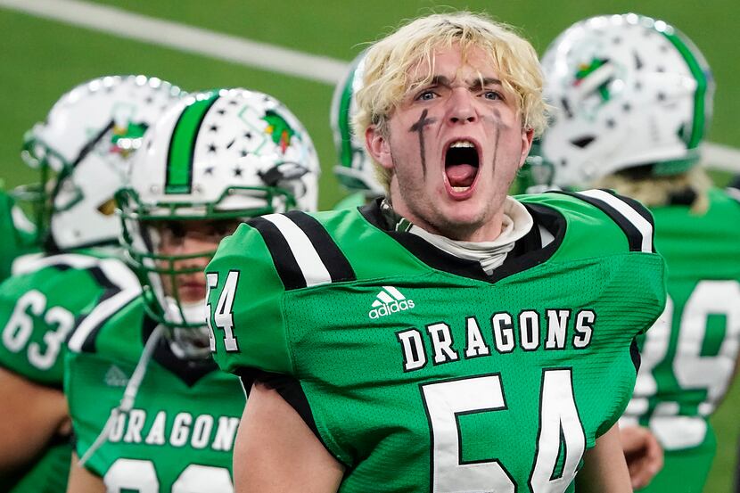 Southlake Carroll defensive lineman Jim Cates (54) yells to try and fire up the crowd during...