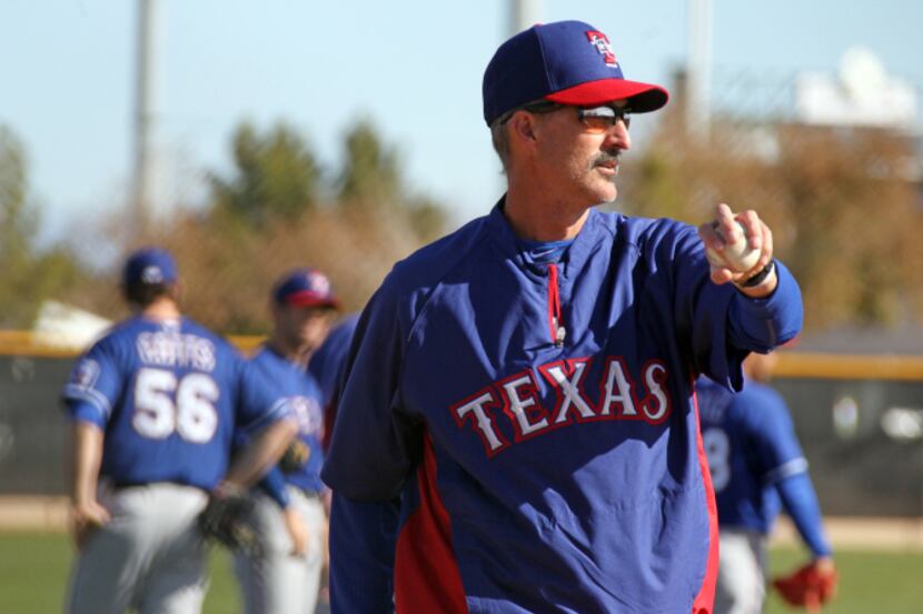 Texas pitching coach Mike Maddux is pictured during the morning workout at theTexas Rangers...