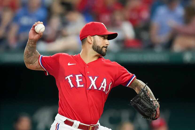 Texas Rangers relief pitcher Matt Bush delivers during the eighth inning against the Seattle...