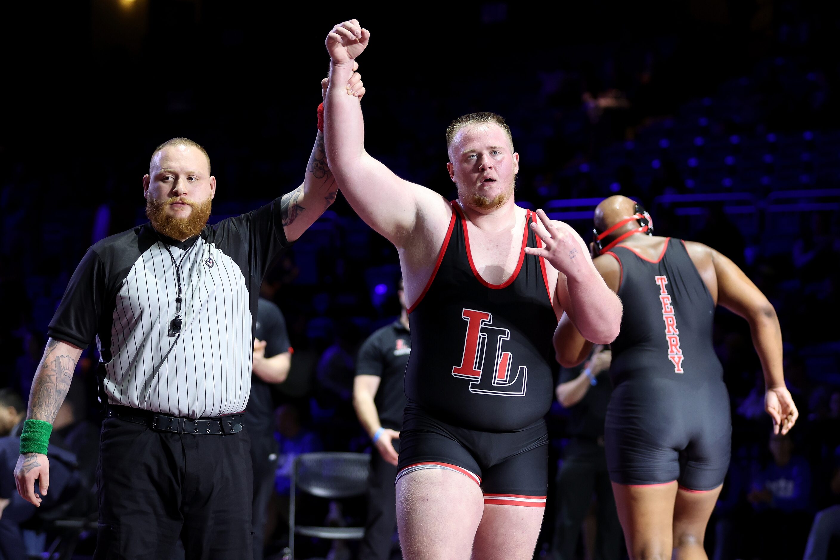 Sam Reynolds of Lovejoy (red) defeats Cameron Lewis of Rosenberg Terry in the Boys 5A...